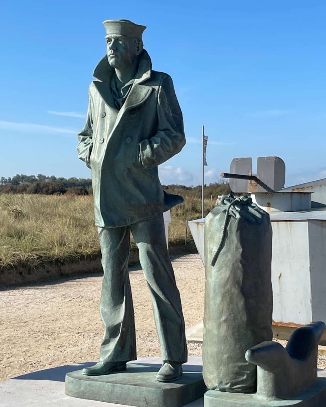 Statue of sailer with duffel bag